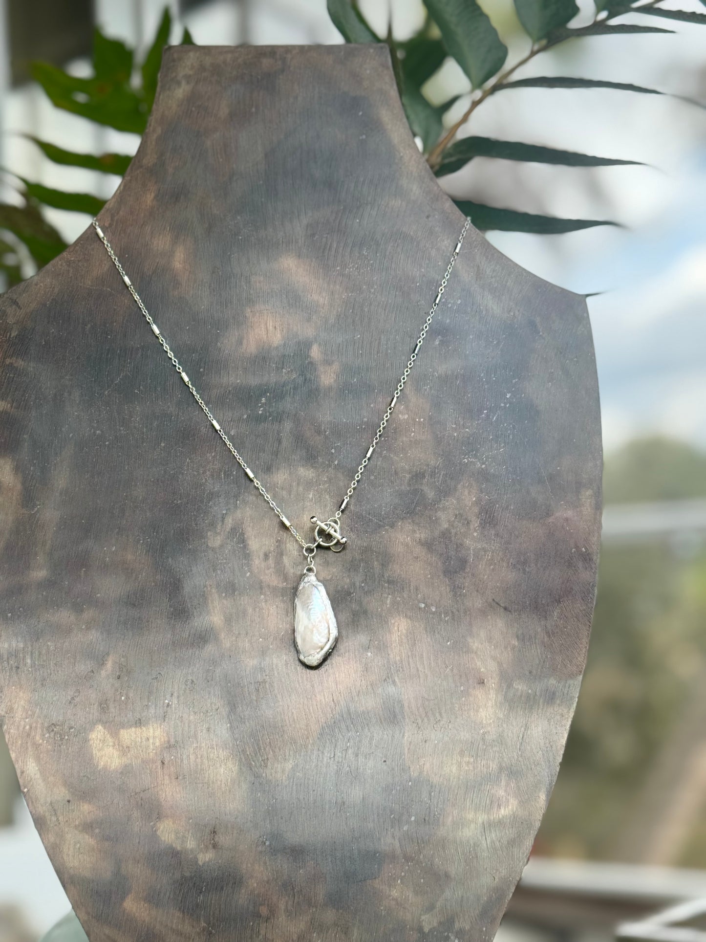 Stainless chain with solder calm shell pendant